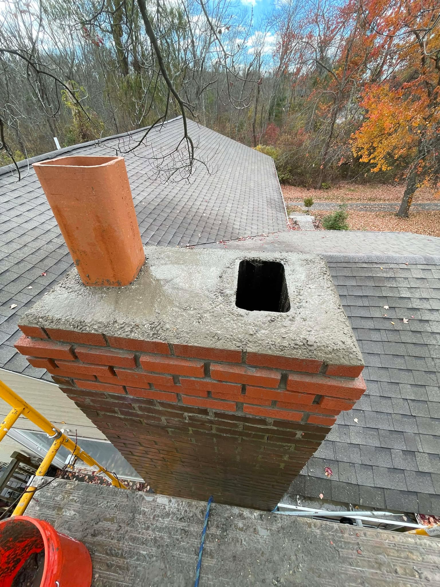 Chimney rebuild above roofline in Plymouth MA by Elite Chimney