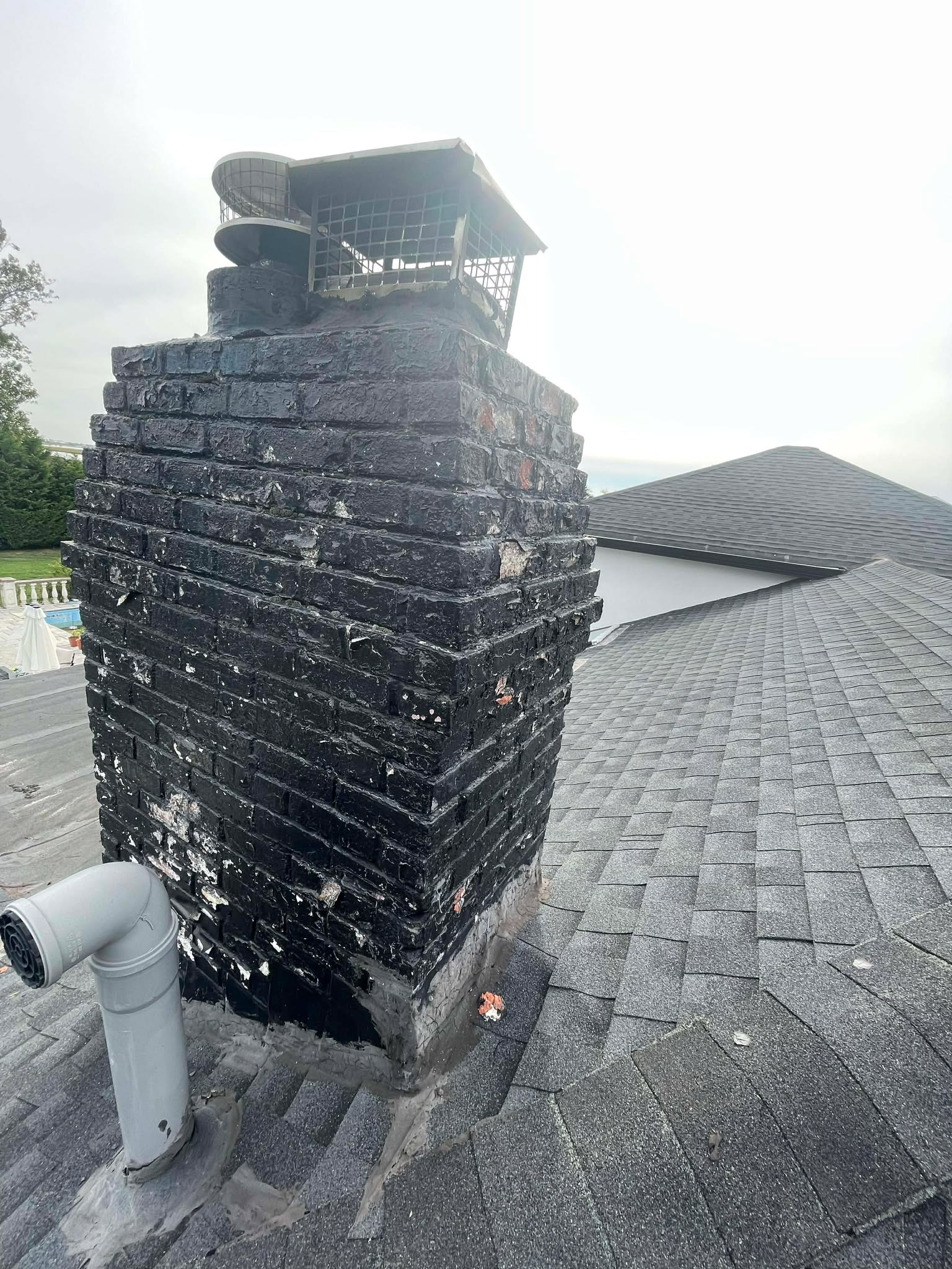 Brick chimney rebuild project in Norwood MA by Elite Chimney